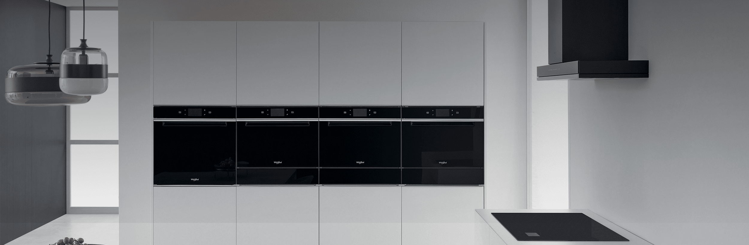Modern kitchen with Whirlpool built-in ovens and appliances